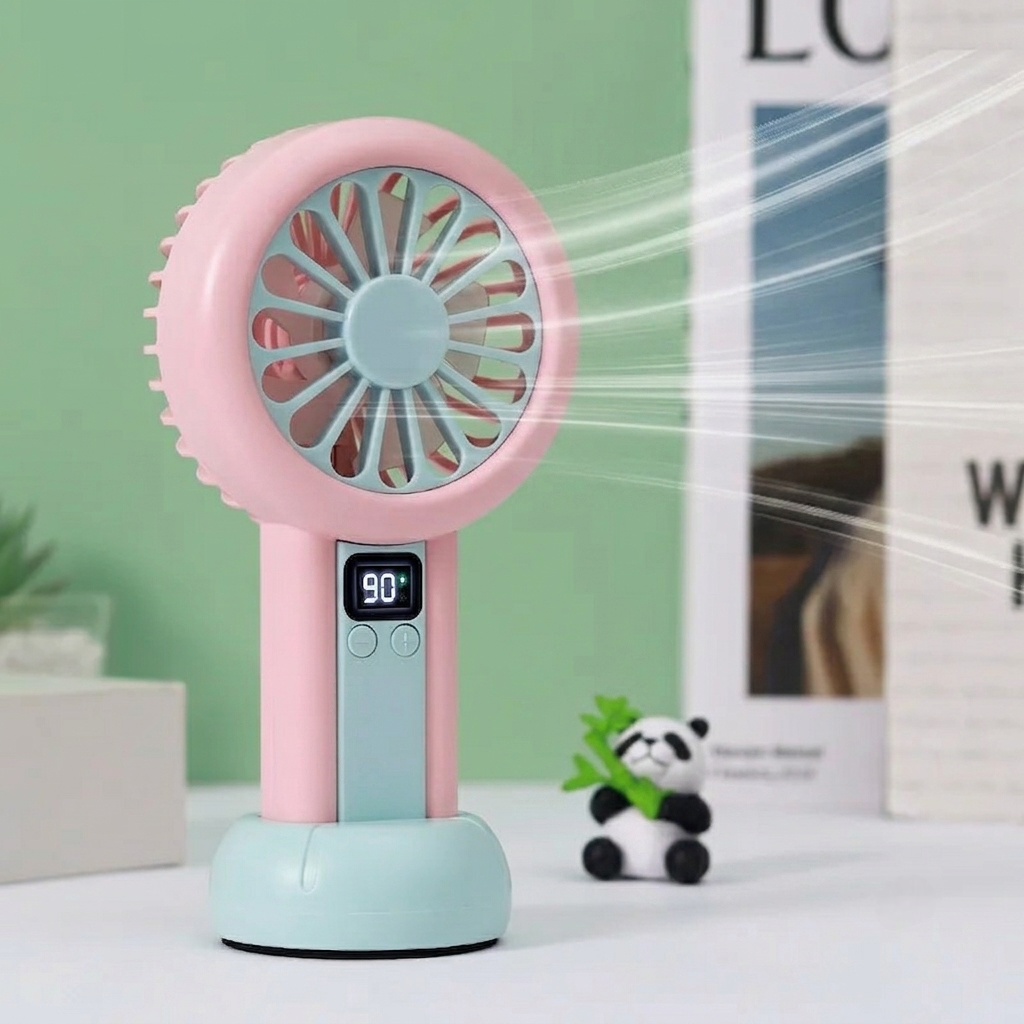 Pink and light blue handheld fan with digital display on a white surface.